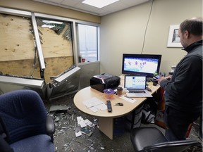 University of Regina Cougars men's hockey coach Todd Johnson sits in his office, which was damaged when a car drove into the Co-operators Centre, on Tuesday.