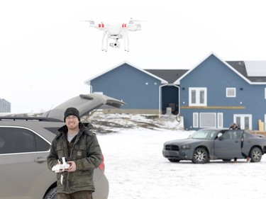 Russell Flaman operates a drone used to document a Winter Rally X race held in a field south of Regina, Sask. on Sunday January 24, 2016. The group plans to run winter races until March.