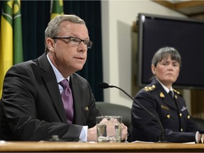 Saskatchewan premier Brad Wall, left and RCMP commanding officer Brenda Butterworth-Carr, right, provide an update on the La Loche school shooting in Regina.