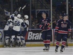 The Saskatoon Blades, left, celebrate a goal against the visiting Regina Pats during first-period WHL action on Saturday.