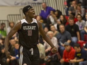 The Archbishop O'Leary Spartans' Adong Makuoi celebrates against the Winnipeg Garden City Collegiate Fighting Gophers in overtime at the BRIT basketball tournament on Saturday.