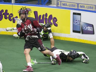 Saskatchewan Rush's Adrian Sorichetti and Jeff Cornwall can't chase down Colorado Mammoth's Callum Crawford in Lacrosse action at SaskTel Center,  January 29, 2016.