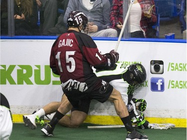 A Saskatchewan Rush player gets nailed against the boards.
