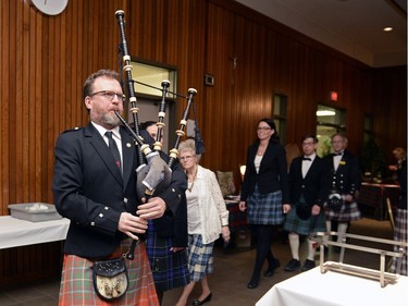 Sean Hall pipes guest into a Robbie Burns Tartan Ceilidh held at St. Mary's Hall in Regina, Sask. on Saturday January 23, 2016.