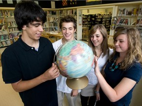 The world at their fingertips: International Baccalaureate students in Quebec play with a globe.