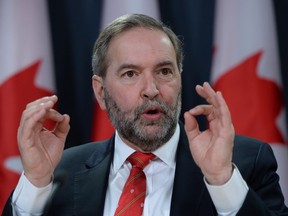 NDP Leader Tom Mulcair holds a press conference at the National Press Theatre in Ottawa on Monday, Jan 18.