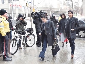 Former CBC broadcaster Jian Ghomeshi and his lawyer Marie Henein arrive at a Toronto court this week. Ghomeshi has pleaded not guilty to four counts of sexual assault and one count of overcoming resistance by choking.