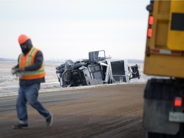 A highways works walks at the site of a fatal accident involving a pick-up truck and a semi north of Balgonie on highway 10 on Thursday Feb. 25, 2016.