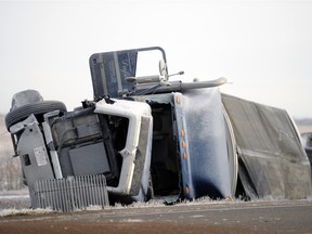 A semi sits in the ditch at the site of a fatal accident involving a pick-up truck north of Balgonie on highway 10 on Thursday Feb. 25, 2016.