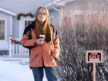 Rudi Bruer, thirty plus year resident and vice-president of the tenant association  of Copper Sands, stands by a for sale sign on his property east of Regina on Tuesday.