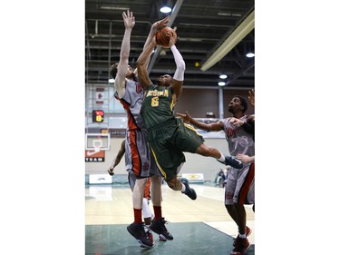Cougars guard Jonathan Tull drives to the net.