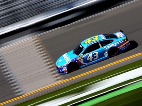 Daytona 500 competitors like Aric Almirola — shown here during Thursday's practice session — will be following WWE star John Cena to the green flag Sunday.