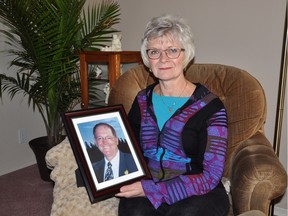 Glynnis Eberts sits with a picture of her late husband, Richard, at her Moose Jaw home on Friday, which would've have been their anniversary.