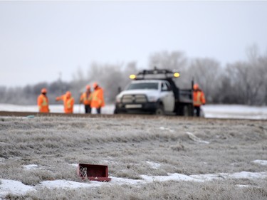 Highway workers sand and clean-up the site of a fatal accident involving a pick-up truck and a semi north of Balgonie on highway 10 on Thursday Feb. 25, 2016.