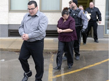 Kevin Goforth, left, and Tammy Goforth, right, are led away from the Court of Queen's Bench in Regina on Saturday Feb. 6, 2016.