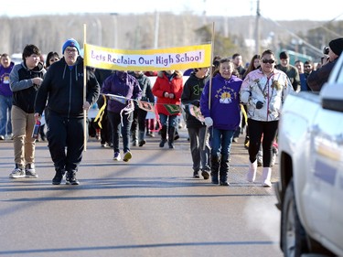 Community members take part in the Reclaiming Our School walk in La Loche  on Wednesday.