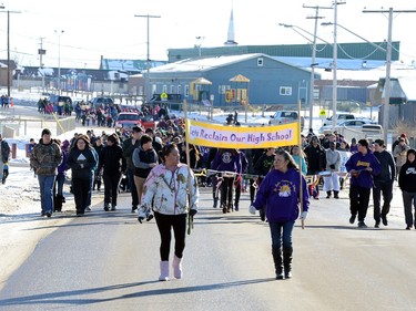 Community members take part in the Reclaiming Our School walk in La Loche  on Wednesday.