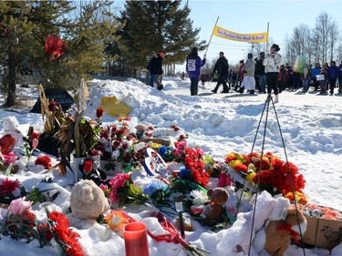 Community members take part in the Reclaiming Our School walk in La Loche  on Wednesday.