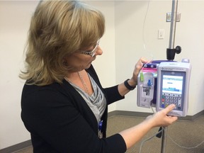 Lori Garchinski, executive director of critical care and cardiosciences with the Regina Qu'Appelle Health Region and chair of the Smart Pump Education and Training Working Group, demonstrates a new "Smart" intravenous pump.