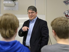 Michael Boda, chief electoral officer for Saskatchewan, speaks to students about his work at Miller Comprehensive High School.