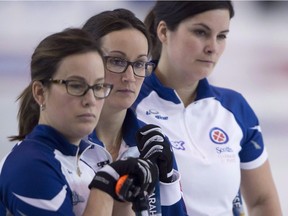 Nova Scotia skip Jill Brothers, centre, pauses for a moment with lead, Teri Udle and second, Blisse Joyce (right) during the fourth draw against Northern Ontario at the Scotties Tournament of Hearts in Grande Prairie, Alta. Sunday, Feb. 21, 2016.