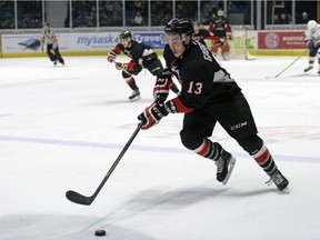 Prince George Cougars forward Jesse Gabrielle (13) brings the puck through the neutral zone during a game held at the Brandt Centre in Regina on Saturday Feb. 6, 2016.
