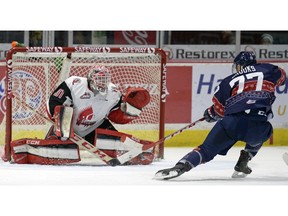 Regina Pats forward Adam Brooks and Moose Jaw Warriors goalie Zach Sawchenko, shown facing each other earlier this season, have been recognized by the CHL for their performances last week.