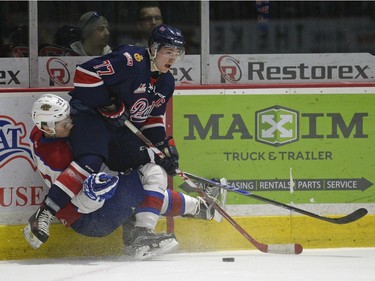 Regina Pats forward Adam Brooks (77) takes the puck while Edmonton Oil Kings defence Dysin Mayo (37) falls to the ice during a game held at the Brandt Centre in Regina on Sunday Feb. 21, 2016.