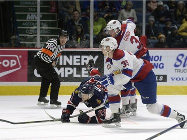 Regina Pats forward Austin Wagner (27) is tripped by Edmonton Oil Kings defence Brayden Gorda (3) during a game held at the Brandt Centre in Regina on Sunday Feb. 21, 2016.