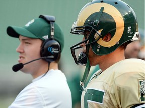 Former University of Regina Rams quarterbacks coach Marc Mueller (left), shown here with then-Rams QB Cayman Shutter during a game in 2013, is looking forward to another season coaching with the CFL's Calgary Stampeders.