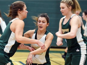 Even though she's a rookie, University of Regina Cougars guard Avery Pearce (centre) has been asked to defend some of the top guards in Canada West this season.