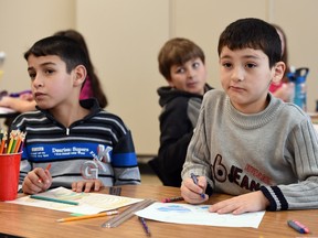 Mohammad Almahameed (L) and Abdelbaree Al Hariri (R), both Syrian refugee students in a Grade 3/4 split class at Marion McVeety School in Regina on Feb. 9, 2016.