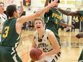 Michael Vanderhooft of the Luther Lions drives to the basket against the Winnipeg John Taylor Pipers during senior boys action at the Luther Invitational Tournament on Thursday.