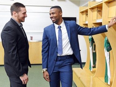 Newly signed Saskatchewan Roughriders Justin Capicciotti (L) and Shamawd Chambers (R) in the Riders dressing room at Mosaic Stadium in Regina on February 11, 2016.