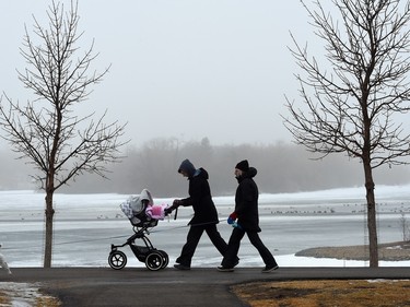 Carolyn Martin  with her mother, Lisa Tabin  and nine-month-old daughter Hatley Martin during a misty fog in Wascana Park in Regina on February 18, 2016.