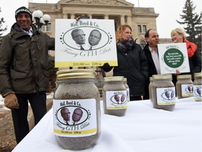 Regina NDP candidates out front of the Saskatchewan Legislative building with jars of dirt priced at $300 each. It's the latest in a series of NDP arts and crafts being used as political props.