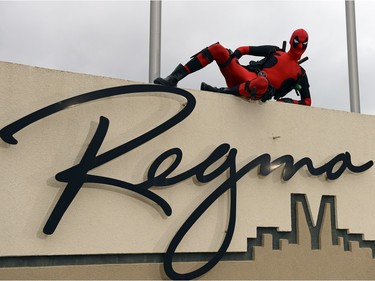 Wade Schnell, local Regina resident dressed up as Deadpool, poses at a number of local spots in Regina on Friday