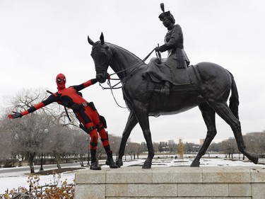 Wade Schnell, local Regina resident dressed up as Deadpool, poses at a number of local spots in Regina on Friday.