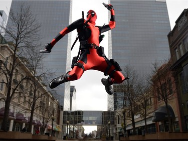 Wade Schnell, local Regina resident dressed up as Deadpool, poses at a number of local spots in Regina on Friday.