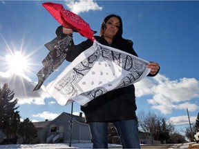 Shawna Oochoo prepares holds bandanas representing the three gangs in the North Central area She is organizing a traditional rag-tie ceremony on Thursday using the bandanas.
