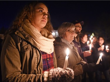 Dakota Sisakis (L) and Debbie Paiement (R) during a vigil being held to draw attention to violence in North Central and elsewhere in Regina.  Core area community members listened to elders speak and sing honour songs and took part in a sweet grass ceremony and made a public call to end violence.