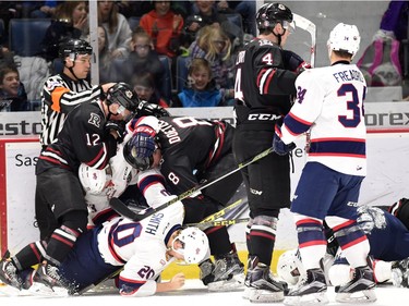 A fight breaks out during 1st period WHL hockey action between the Regina Pats and the Red Deer Rebels at the Brandt Centre in Regina on February 29, 2016.