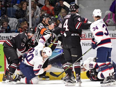 A fight breaks out during 1st period WHL hockey action between the Regina Pats and the Red Deer Rebels at the Brandt Centre in Regina on February 29, 2016.