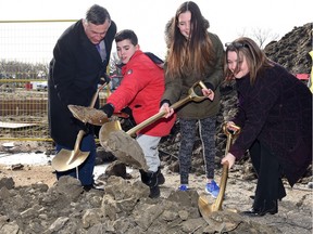 From left, Education Minister Don Morgan, students Hayden Dull and Serena Leveaque, along with Katherine Gagne, chair of the Regina Public Schools board, breaking ground at the site of the new École Connaught Community School, located at 13th Avenue and Elphinstone Street.