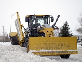 Mike Volk, City of Regina roadways operations, uses a grader to clear snow