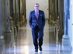 Saskatchewan Premier Brad Wall walking back to his office at the legislative building. Is Wall making a mistake not tabling a budget this spring?