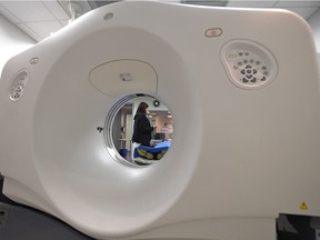 Dr. Andrea Gourgaris, a radiologist at Radiology Associates of Regina, demonstrates a CT scanner in Regina.