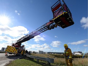 Firefighter Mark Perry with Regina Fire and Protective Services' new aerial platform truck, also know as Raptor, in Regina on Oct. 3, 2014.