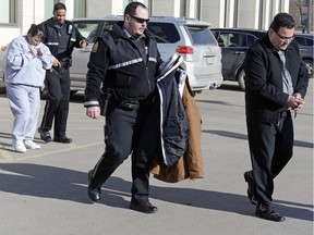 Kevin and Tammy Goforth leave Court of Queen's Bench in handcuffs and leg shackles on Feb. 12, 2016 after sentencing submissions. Tammy was convicted of second-degree murder in the death of a four-year-old girl, while her husband Kevin Goforth was found guilty of manslaughter. Both were also convicted of unlawfully causing harm to another child.