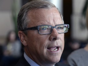Premier Brad Wall speaking at a news conference.
